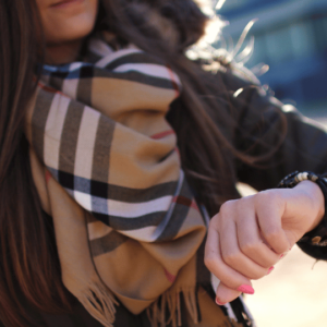 A woman wearing a Burberry scarf